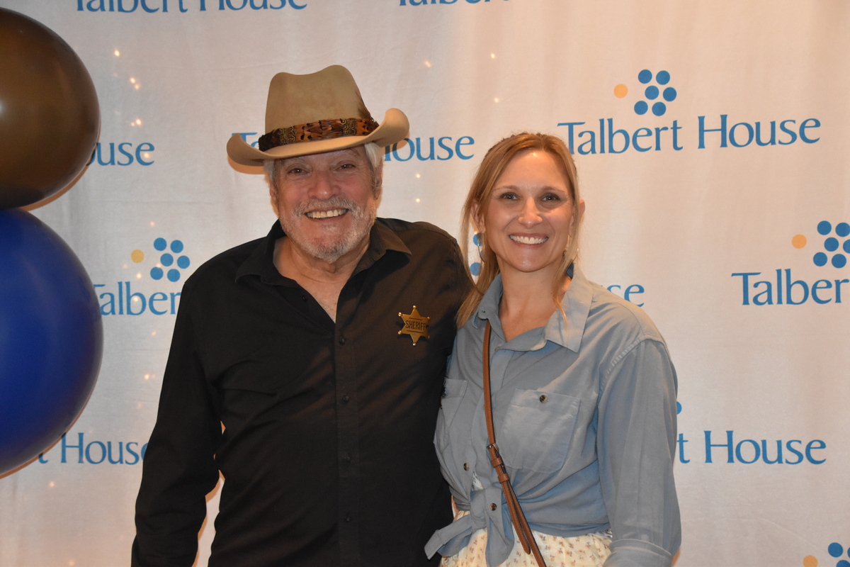 Two event attendees in western attire